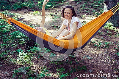 Happy mom and daughter playing in a hammock Stock Photo