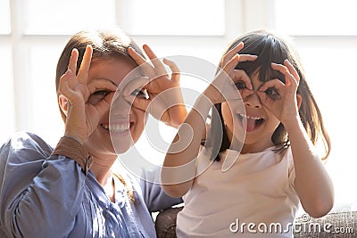 Happy mom and little daughter have fun at home Stock Photo