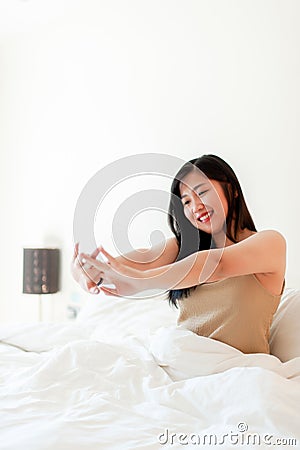 Wake up happy in the morning in bed Enough rest, full sleep, and a smile full of happiness. happy bedroom Stock Photo