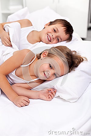 Happy morning lazing kids Stock Photo