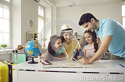 Happy mother with daughters listening father talking about vacation trip Stock Photo