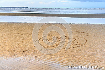 Happy Mother's Day written in the sand Stock Photo