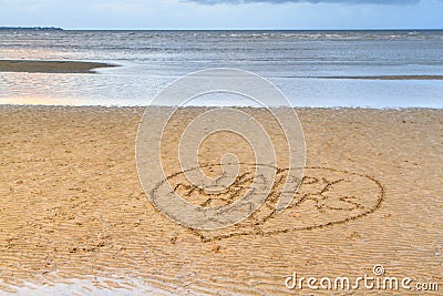 Happy Mother's Day written in the sand Stock Photo