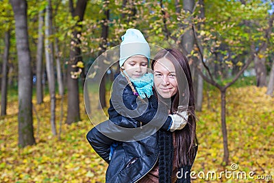 Happy mother and her cute daughter having fun in Stock Photo