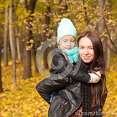 Happy mother and her cute daughter walking in Stock Photo