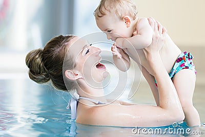 Mother and her newborn child at infant swimming class Stock Photo