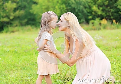 Happy mother and little daughter child in summer day Stock Photo