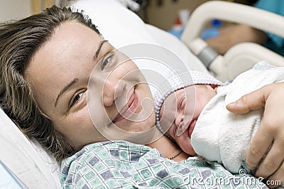 Happy mother with newborn baby Stock Photo