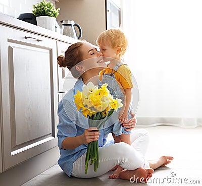 Happy mother`s day! baby son gives flowersfor mother on holiday Stock Photo