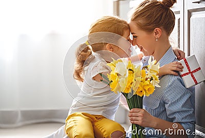 Happy mother`s day! child daughter gives mother a bouquet of f Stock Photo