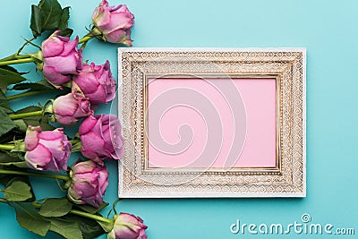 Happy Mother`s Day, Women`s Day, Valentine`s Day or Birthday Flat Lay Background. Beautiful picture frame, fresh pink roses. Stock Photo