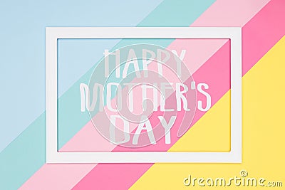 Happy Mothers Day abstract geometrical pastel blue, pink and yellow paper flat lay background. Minimalism greeting card. Stock Photo