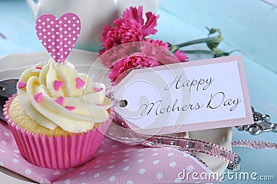 Happy Mothers Day aqua blue vintage retro shabby chic tray with pink cupcake close up Stock Photo