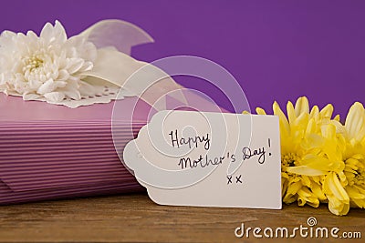 Happy mothers day card on gift box with flowers Stock Photo