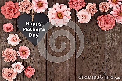 Happy Mothers Day chalkboard heart with flower corner border on wood Stock Photo