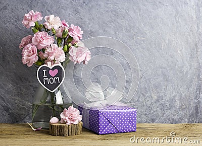 Happy mothers day concept of pink carnation flowers in bottle Stock Photo