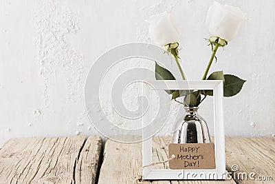 happy mothers day inscription with white roses vase. High quality photo Stock Photo