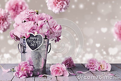 Happy mothers day letter on wood heart and pink carnation flower Stock Photo