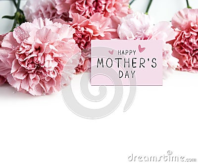 Happy mothers day message on paper and pink carnation flower Stock Photo