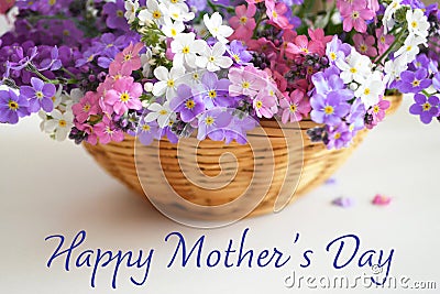 Happy Mothers Day. Mothers Day flowers in the basket Stock Photo