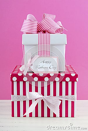 Happy Mothers Day pink and white gift with greeting card. Stock Photo