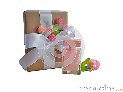 Gift box with bowknot and floral decor, perfume, handmade soap on white background. Stock Photo