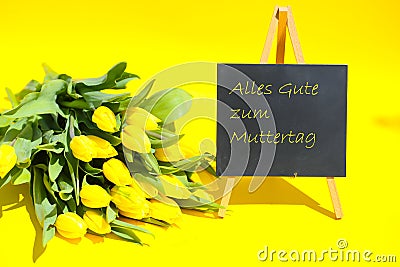 Happy mothersday, yellow tulips on yellow background, chalkboardn, postcardnflower, Stock Photo