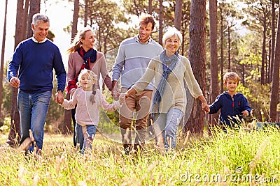 Happy multi-generation family walking in the countryside Stock Photo