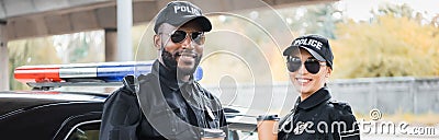 Happy multicultural police officers with paper Stock Photo