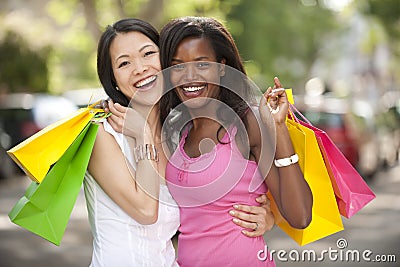 Happy multiethnic friends shopping Stock Photo