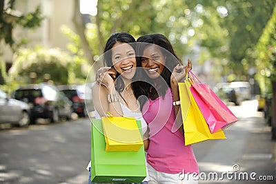 Happy multiethnic friends shopping Stock Photo