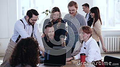 Happy multiethnic smiling colleagues work together, discuss project at loft office brainstorming conference meeting. Stock Photo