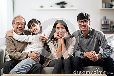 Happy multigenerational asian family portrait in living room Stock Photo