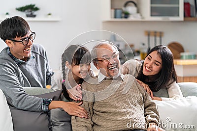 Happy multigenerational asian family portrait in living room Stock Photo