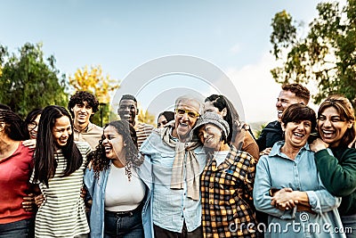 Happy multigenerational people having fun together in a public park Stock Photo