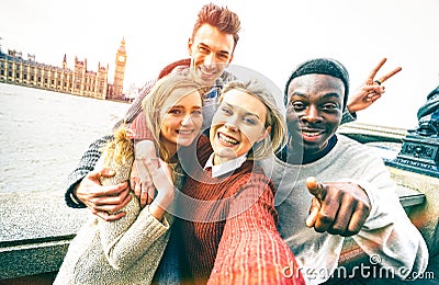 Happy multiracial friends group taking selfie in London city Stock Photo