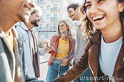 Happy multiracial friends having fun together walking on city street Stock Photo