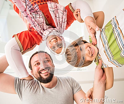 Happy Muslim family at home Stock Photo