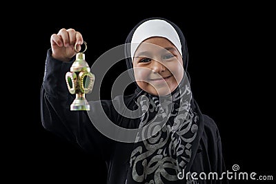 Happy Muslim Girl Smiling with Ramadan Lantern Stock Photo