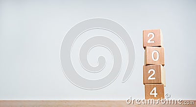 Two thousand Twenty-Three year numbers on wooden cube blocks stack on white background. Stock Photo