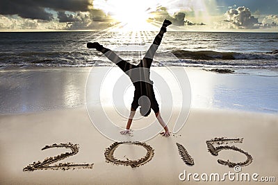 Happy new year 2015 on the beach with sunrise Stock Photo