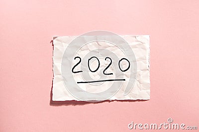 2020 Happy new year card with numbers, paper on pink background Stock Photo