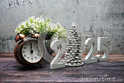 Happy New Year 2025 and Christmas Holiday Decoration on wooden background Stock Photo