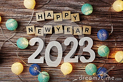 Happy New Year 2023 decorate with LED cotton ball on wooden background Stock Photo