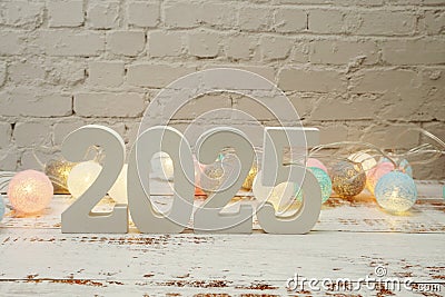 Happy New Year 2025 festive background with space on wooden background Stock Photo