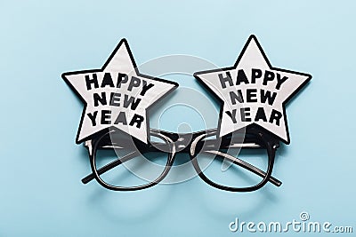 Happy New Year glasses on blue background, top view Stock Photo