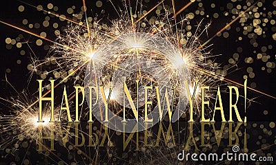 Happy New Year Gold Text with Sparklers Stock Photo