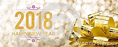 Happy new year 2018 with golden gift box with big bow at sparkling bokeh blur background,Holiday greeting card banner Stock Photo