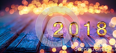 2018 - Happy New Year - Golden Numbers On Defocused Table Stock Photo