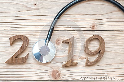 2019 Happy New Year for healthcare, Wellness and medical concept. Stethoscope with wooden number on table Stock Photo